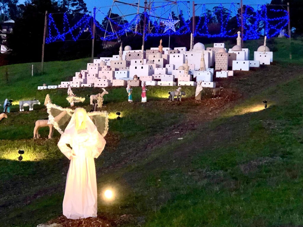 shadi holiday display angel and bethlehem at dusk