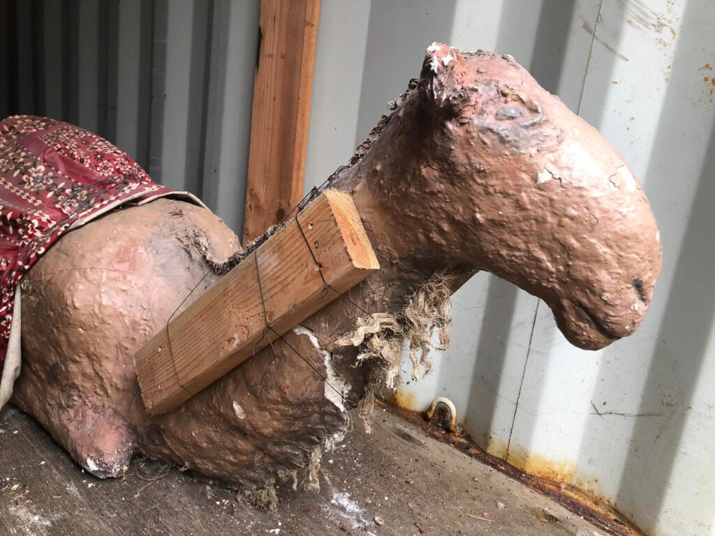 camel figure being repaired