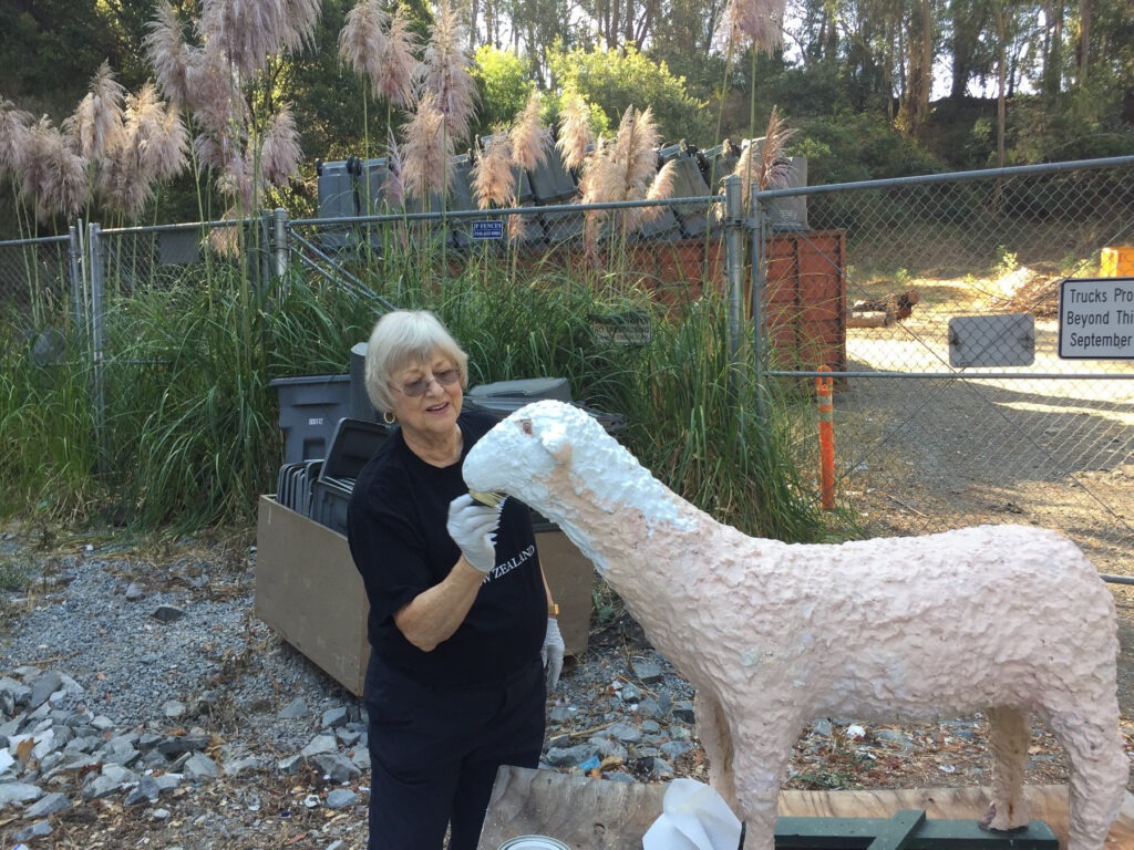 jane bartke repairing a sheep figure