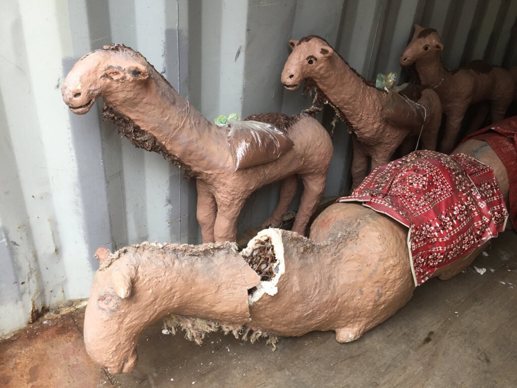 broken camel figures in storage