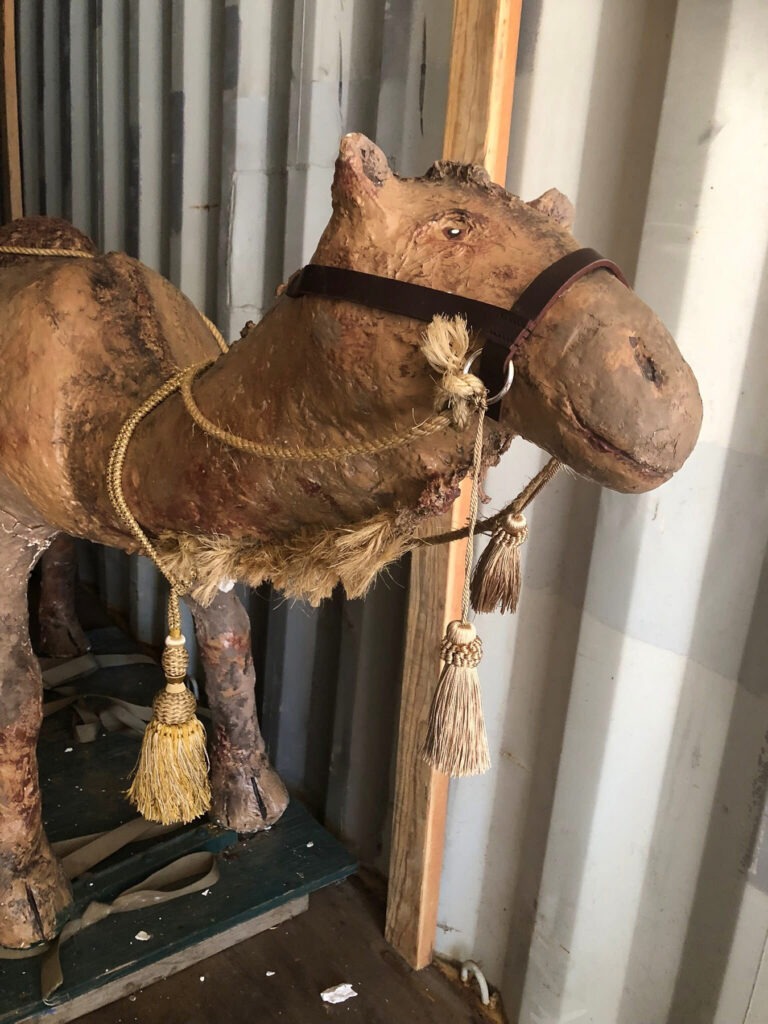 camel figure with tassels in storage
