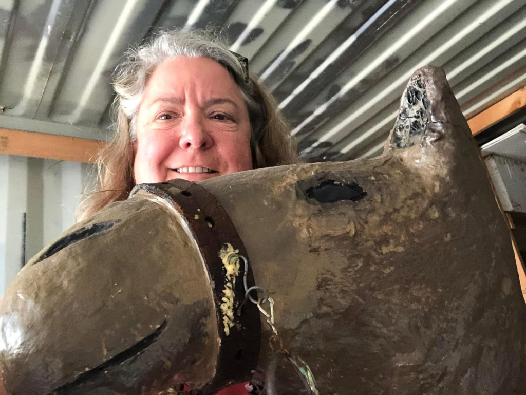 michelle posing with camel figure